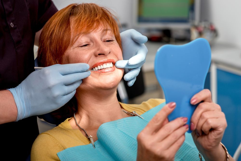 Photo of a woman smiling in the dentist's chair